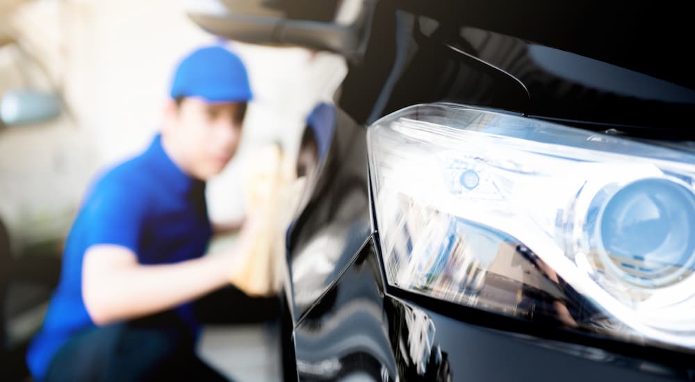 Car being wiped dry after a car wash near The Woodlands