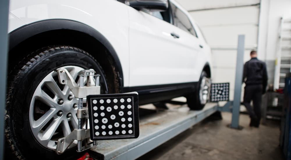 White SUV getting a wheel alignment near Waller