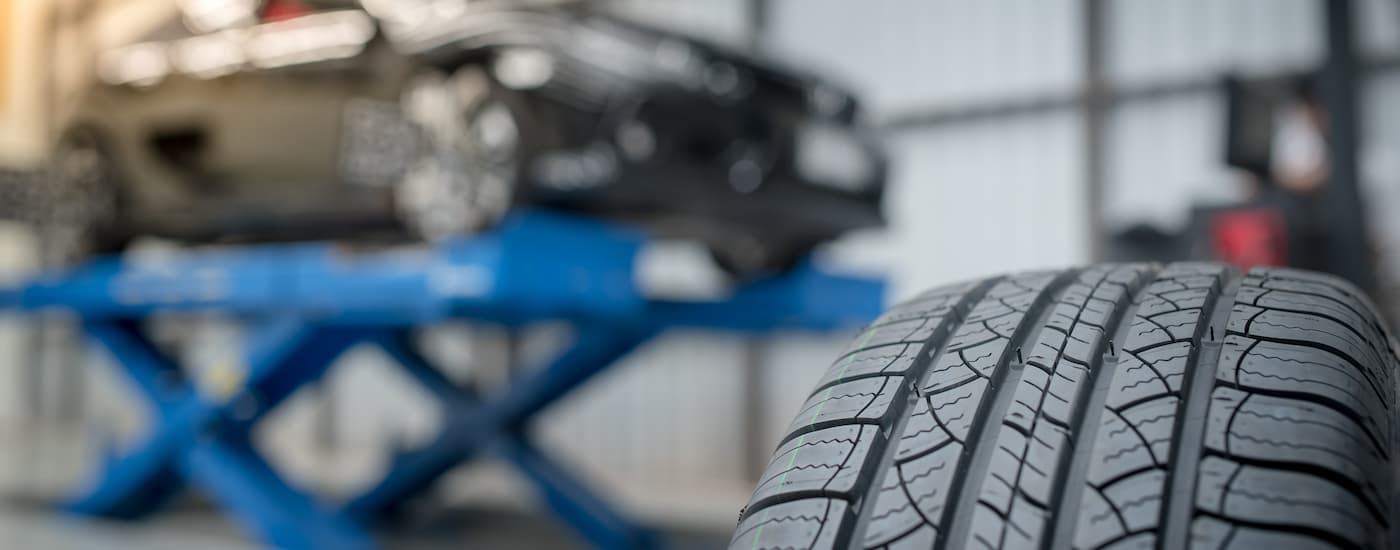 Vehicle on a lift and a tire