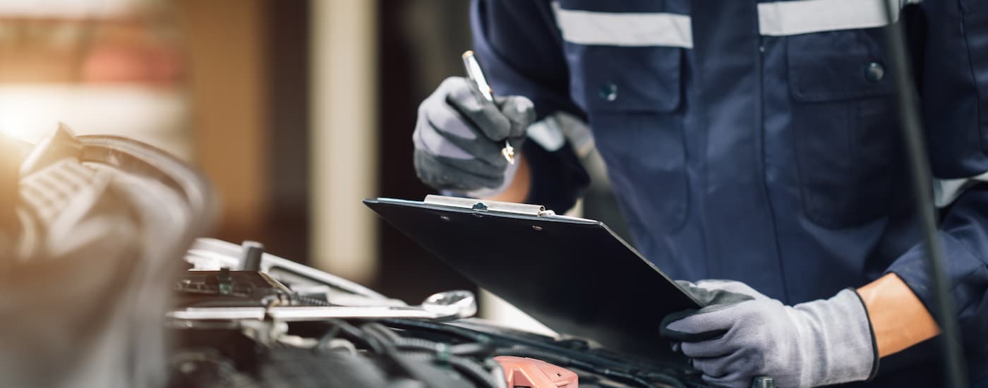 A mechanic doing vehicle maintenance