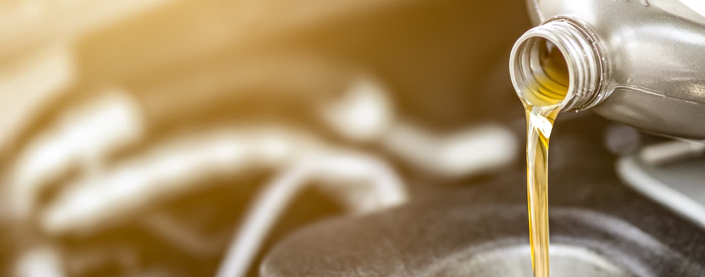Close-up of an oil can being poured.
